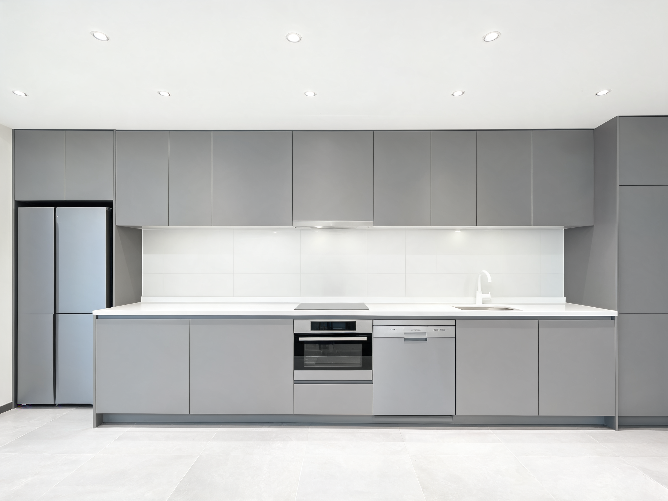 Quartz kitchen countertop — sleek white quartz in a modern minimalist kitchen
